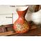 This image shows the cat vase is 10 by 6 inches. The shape of the gourd curves in at the center, and outward at the top rim. 